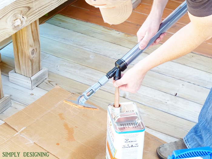 putting stain in stain applicator