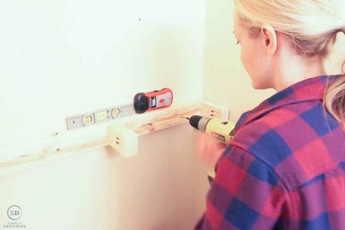 attach inside bracket of floating shelf to the wall