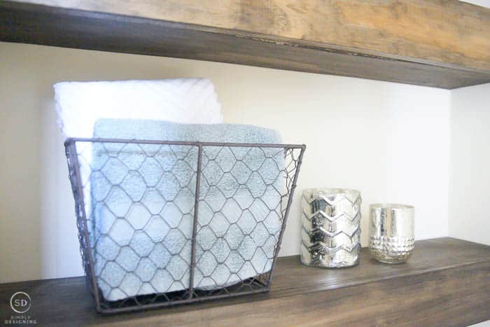 floating shelf decorations in a bathroom