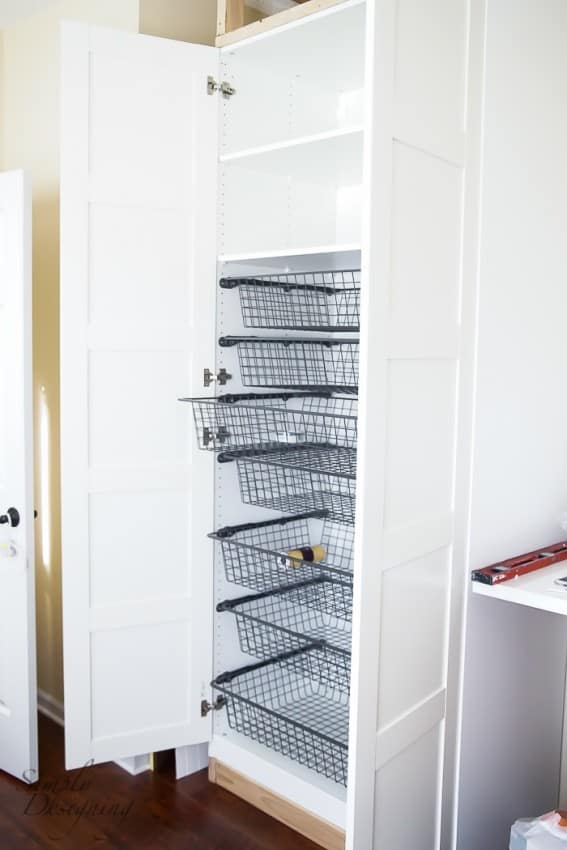 Storage bins in cabinets