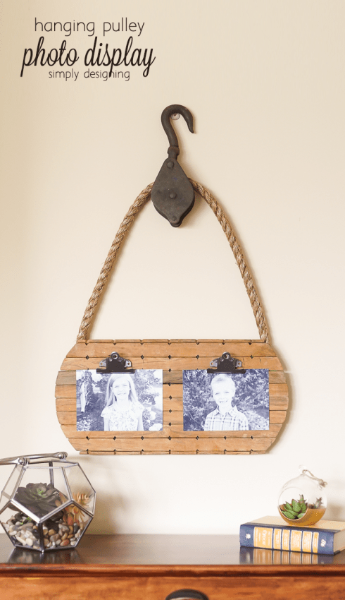 hanging pulley photo display - you wont believe the thrift store finds I made this from