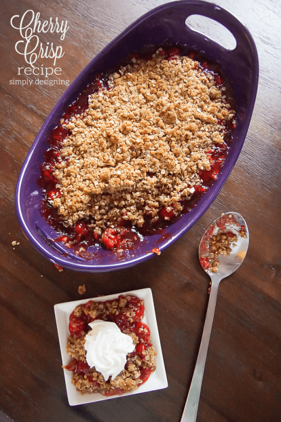 cherry crisp baked in a purple dish and served on a white plate