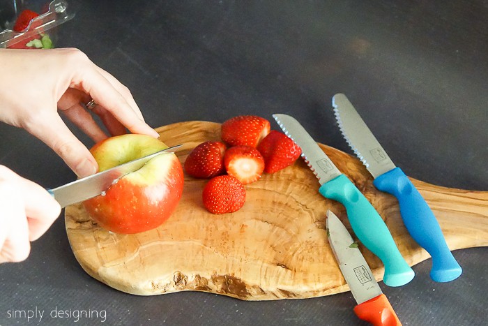 Cutting apples and strawberries with Chicago Cutlery Knives for dipping in Nutella Recipes