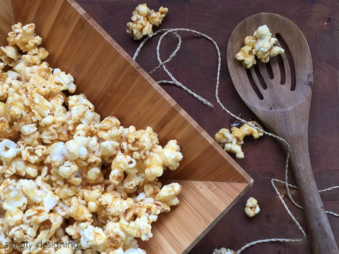 quick caramel popcorn in a wooden bowl