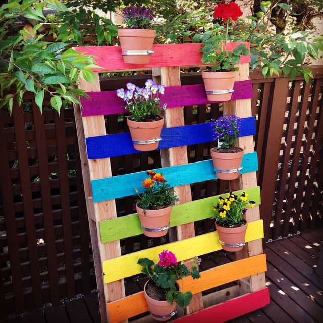 Create-a-bright-and-colorful-upcycled-rainbow-pallet-planter-project-with-these-simple-instructions-from-Hello-Creative-Family.-A-great-family-weekend-project-that-kids-will-love.