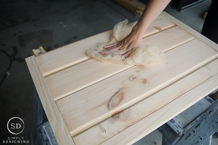 Using a Tack Cloth to remove all of the sawdust from the custom baby gate