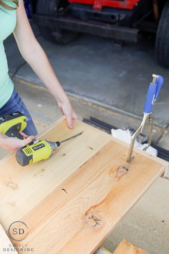 Using Ryobi Drill to secure 1x3" sides to 3 sides of each shelf for the printer table using pocket holes