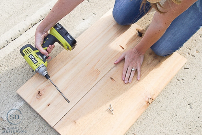 Making shelves for Printer Table using Ryobi drill to screw 2 10" wide boards together using pocket holes