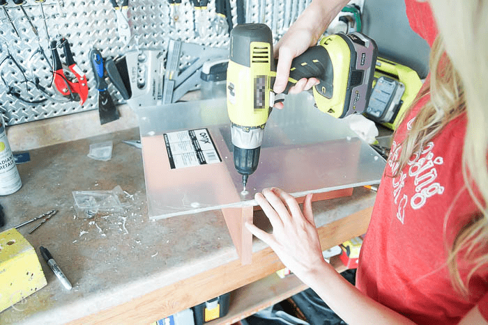 drill pilot holes into table