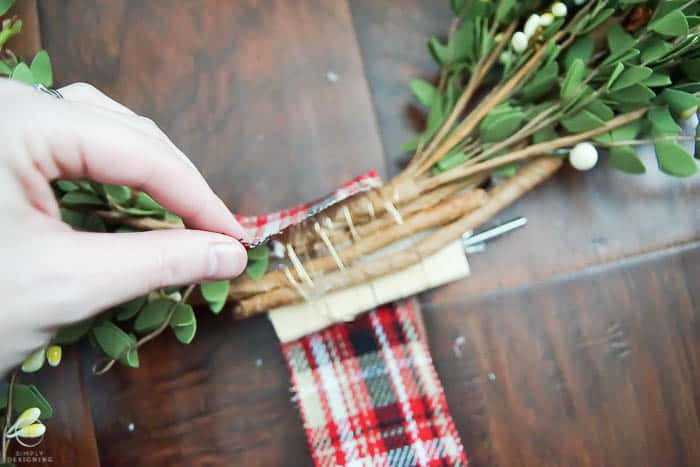 Cover middle of wreath stems with ribbon