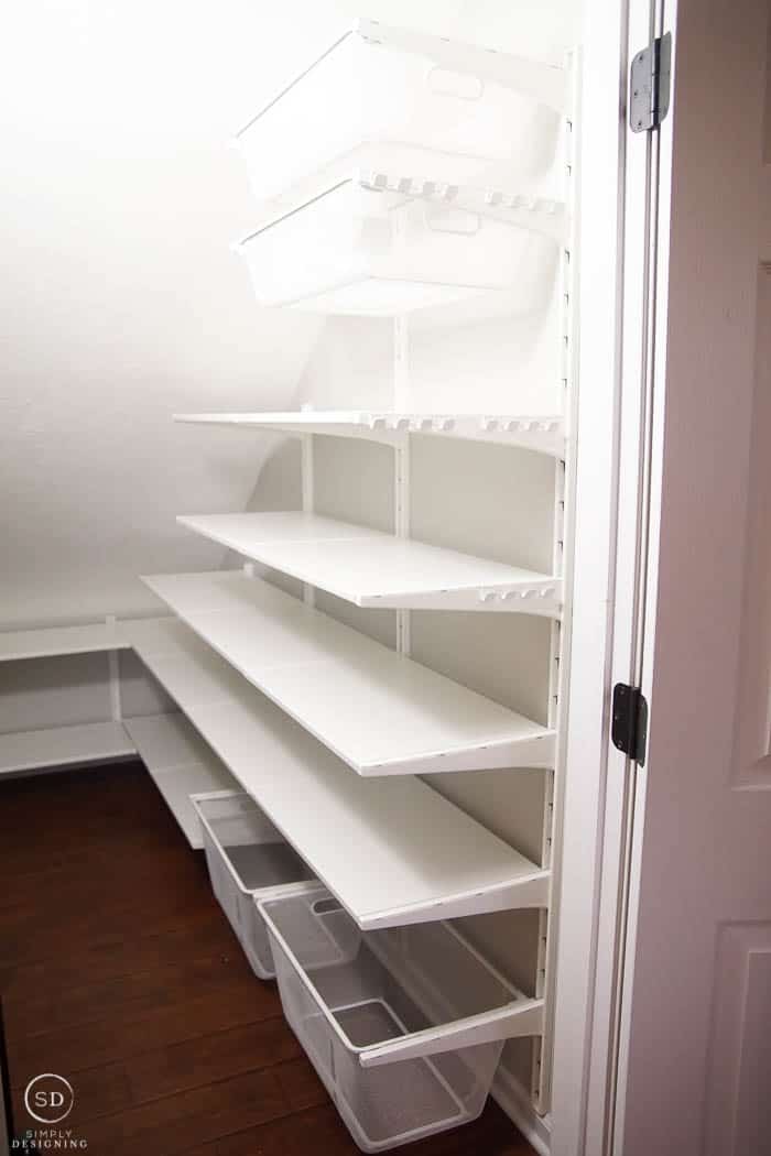 IKEA ALGOT shelves in a closet under the stairs