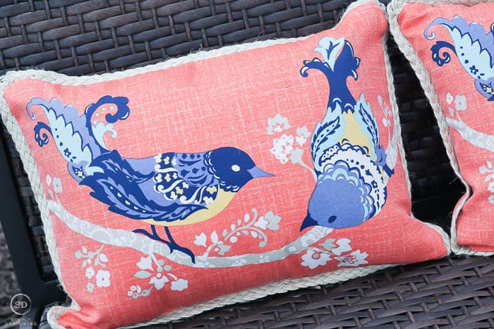 coral pillow with birds