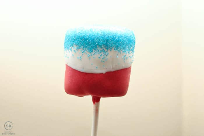 add blue colored sugar to create this 4th of July Marshmallow Pop