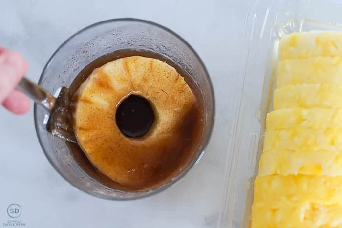 dip pineapple in butter sugar and cinnamon mixture