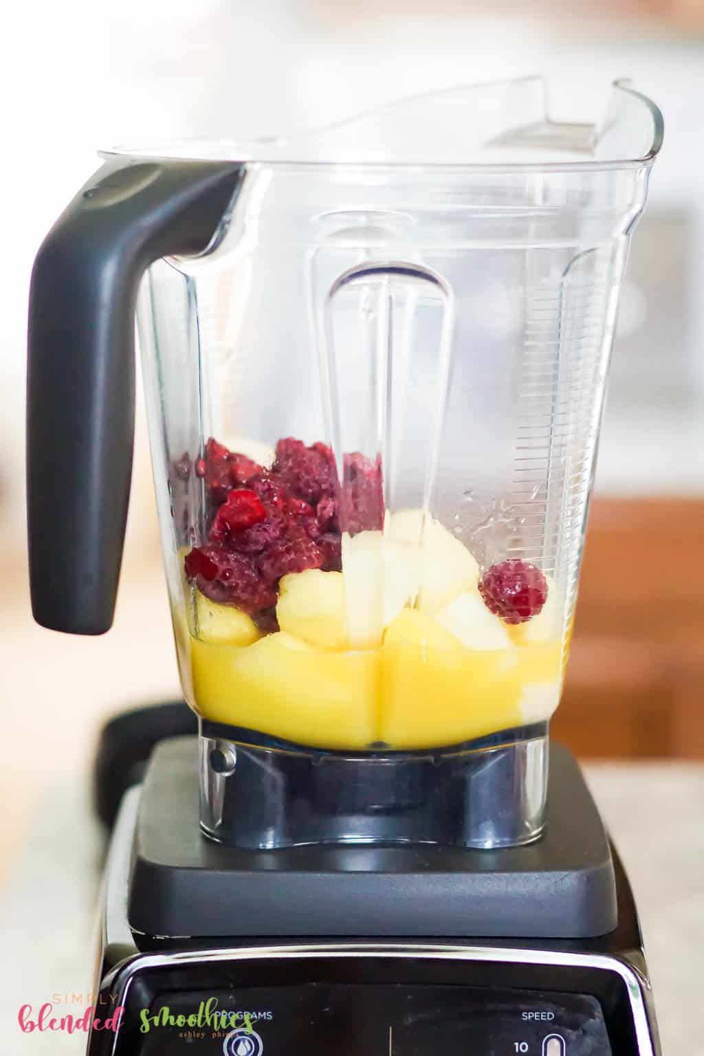 Pineapple Raspberry Smoothie 7 Pineapple Raspberry Smoothie ingredients in a blender