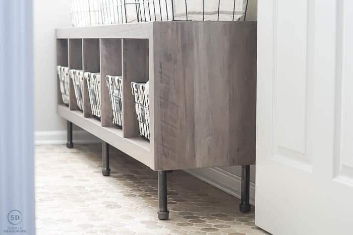 Industrial farmhouse storage cube in laundry room