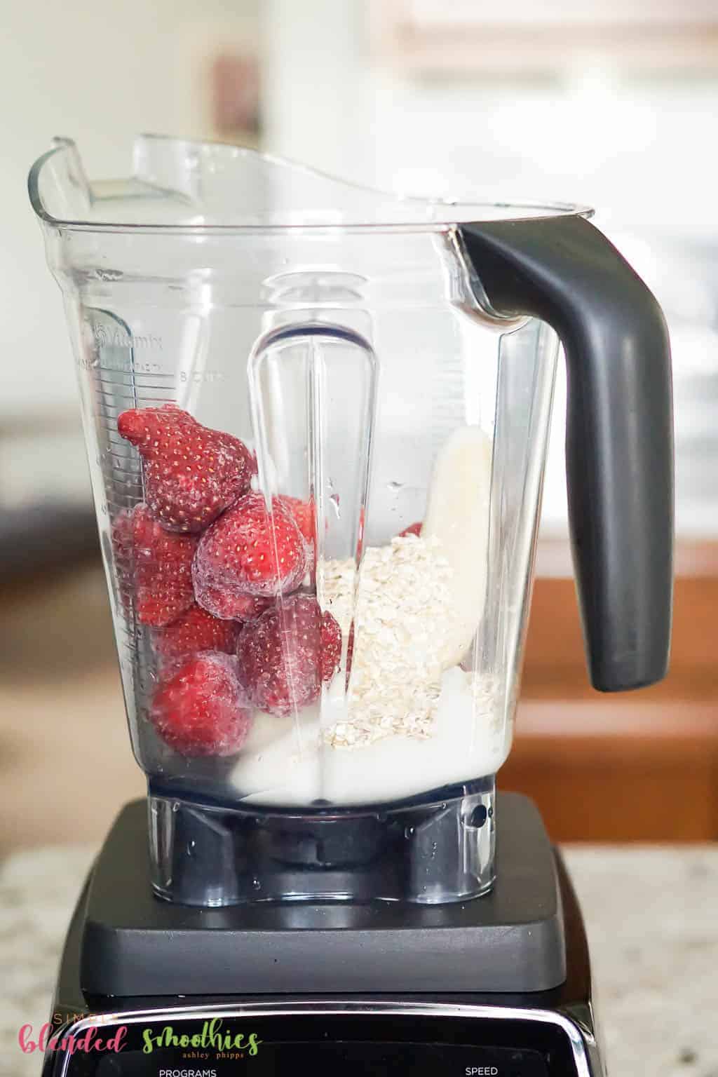 Strawberry Oatmeal Smoothie Bowl 9 Strawberry Oatmeal Smoothie Bowl ingredients in a blender
