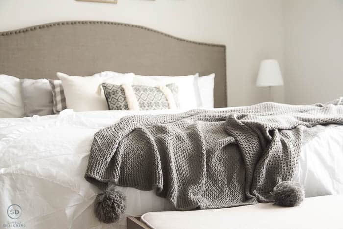 gray pom pom blanket