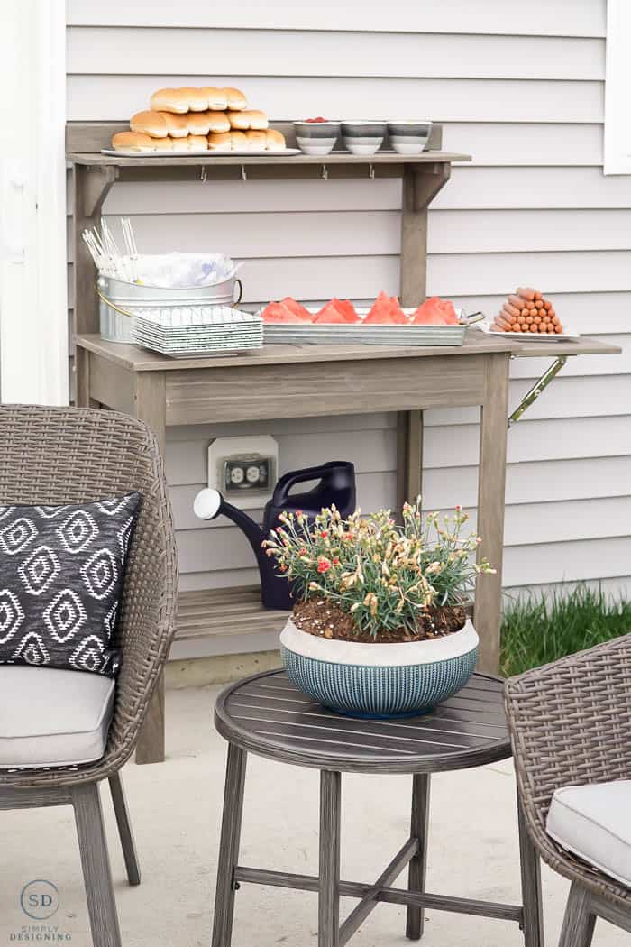 re-purposed planting bench to hold food at summer dinner party