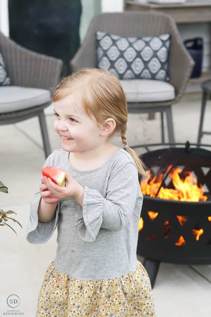 eating watermelon at summer dinner party