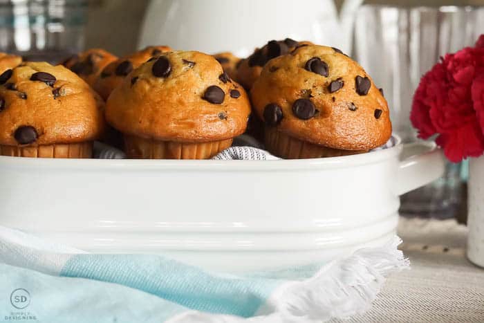 white serving dish with muffins in it