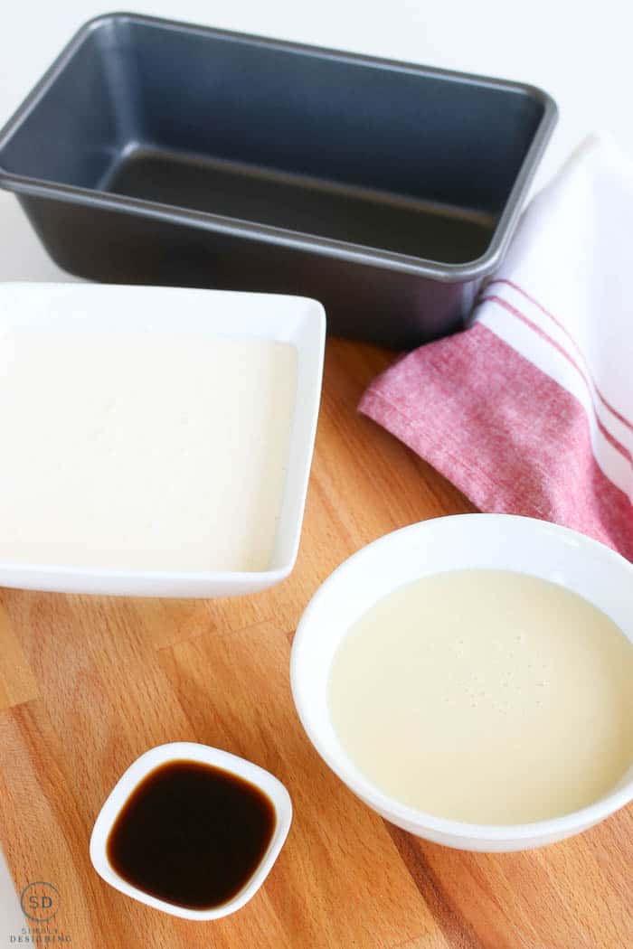 Simple ingredients for homemade ice cream, whipping cream, sweetened condensed milk, and vanilla for flavoring.