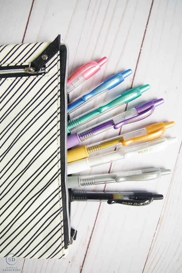 pens in black and white pen case