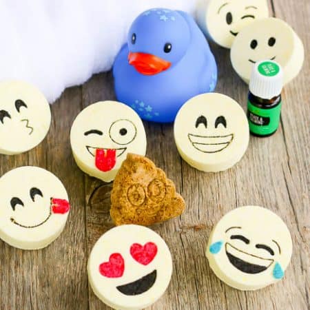 The final product of this bath bombs recipe are these adorable kids bath bombs with emoji faces. A fun show showing the completed bath bombs and other bath essentials.