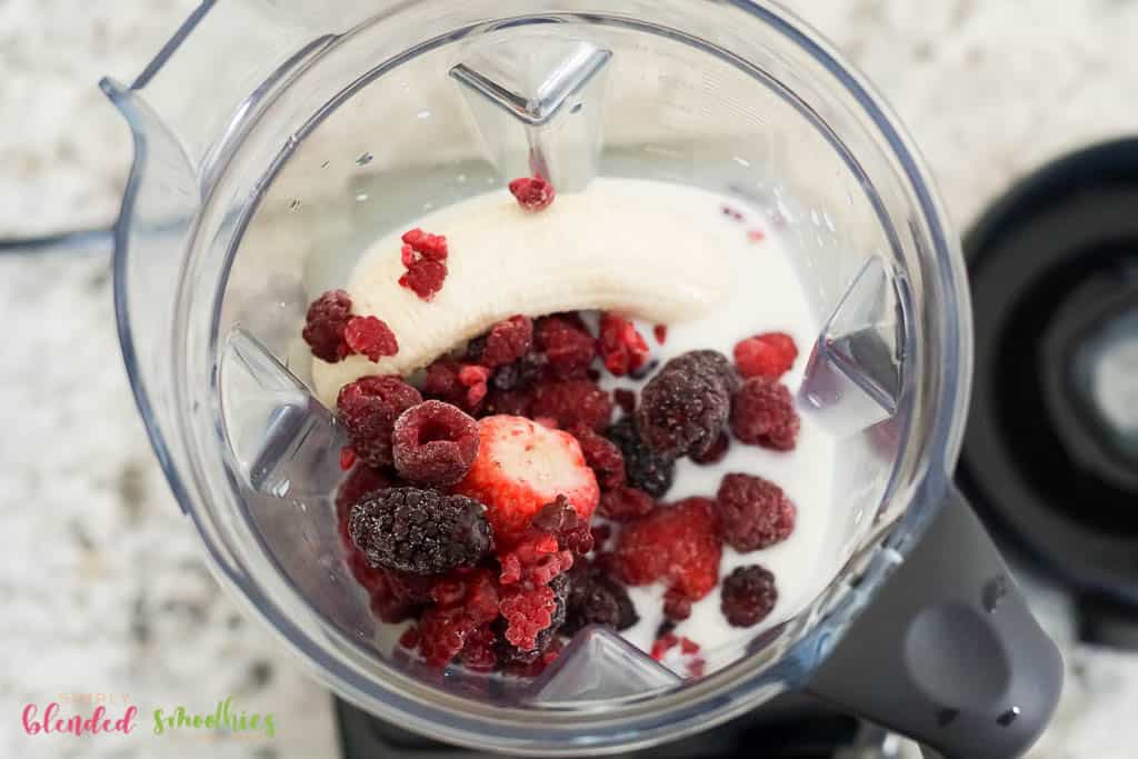 Berry Smoothie 8 healthy smoothie ingredients in a blender photo from the top down