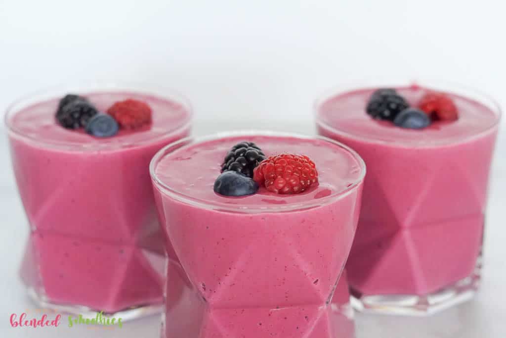 Berry Smoothie 4 horizontal photo showing three Berry Smoothies with berries on top