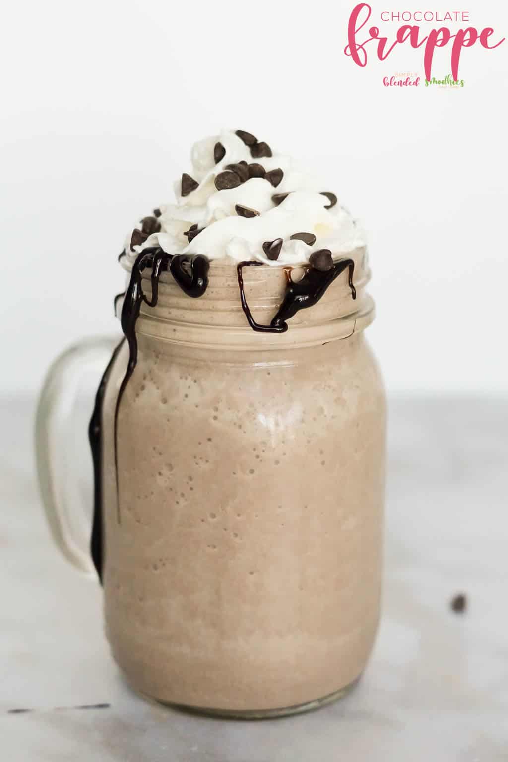 Delicious Vanilla Frappe 10 Chocolate Frappe Recipe in a glass cup with whipped cream chocolate drizzle and mini chocolate chips
