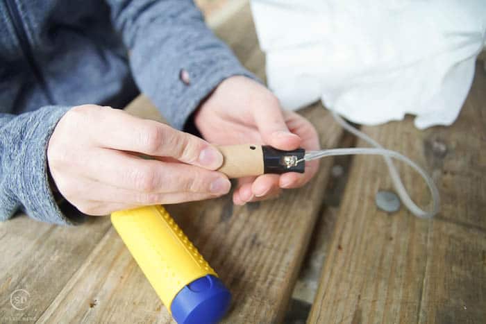 place cardboard cylinder back on socket 