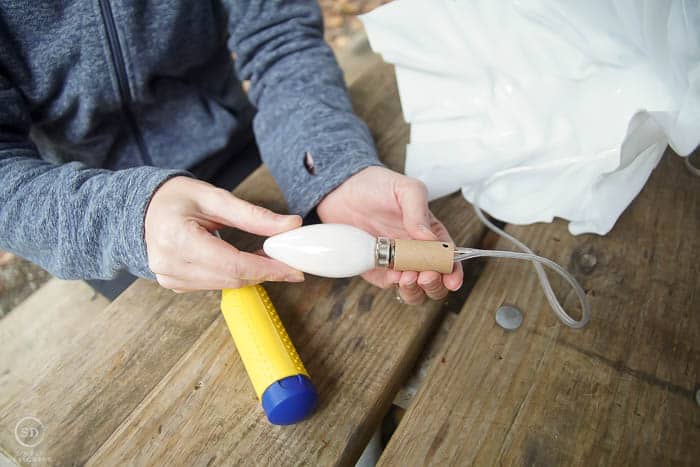 screw light bulb into socket