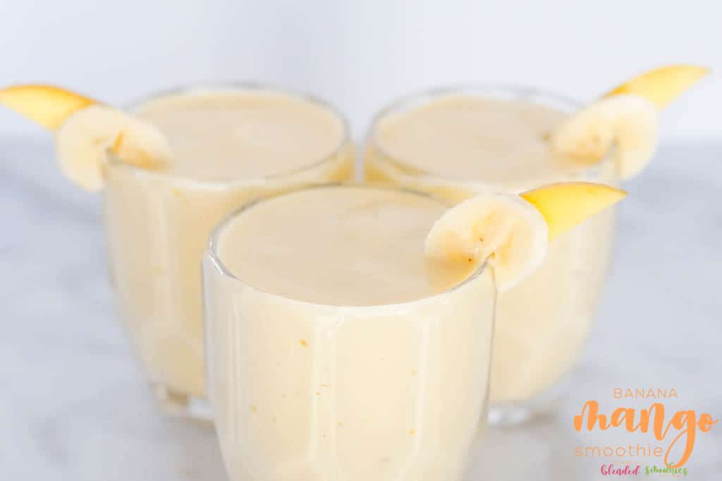 Mango Banana Smoothie 4 Mango Banana Smoothie horizontal photo with banana and mango slices