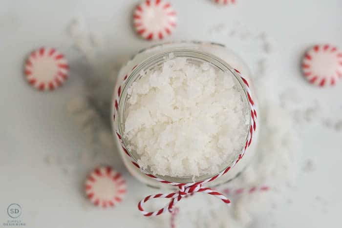 photos of peppermint sugar scrub looking straight down on it in a jar surrounded by red and white peppermint candies