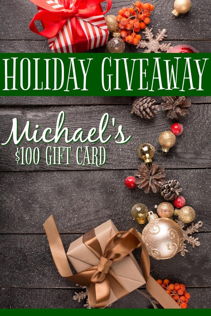 2019 Holiday Michaels Giveaway - Christmas still-life with red and golden ornaments, fir-cones on a wooden table