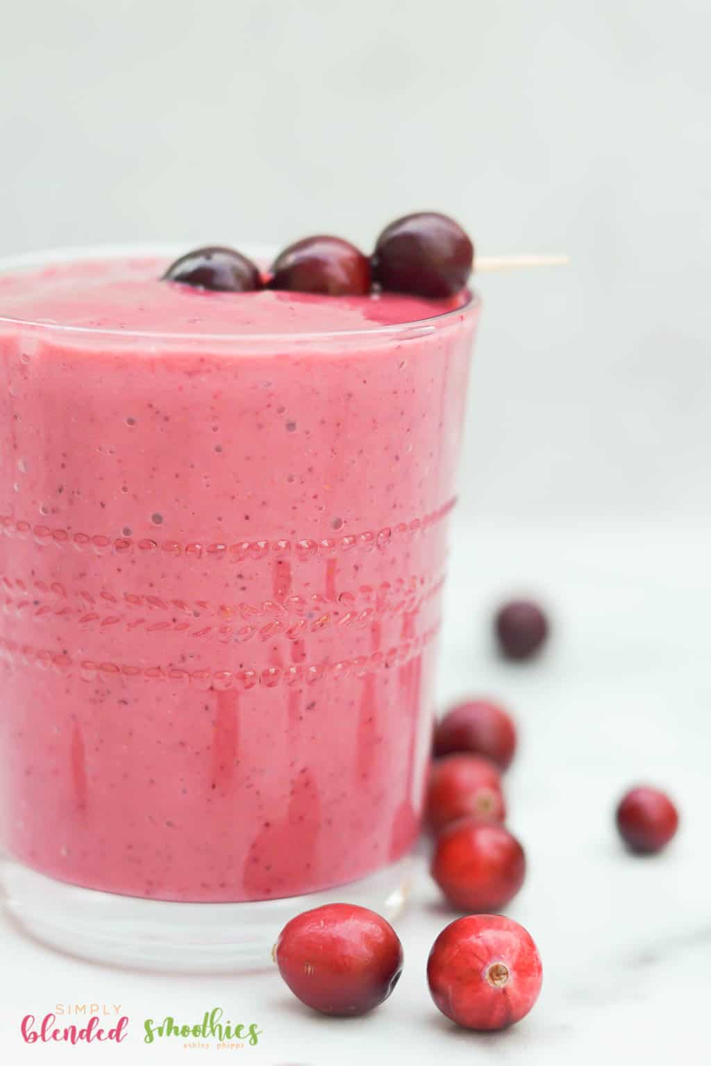 Eggnog Milkshake 18 Cranberry Smoothie close up photo with fresh cranberries as garnish