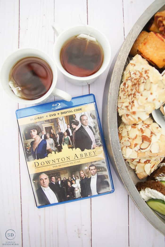 English Tea Charcuterie Board teaser with Downton Abbey DVD and peppermint tea in white tea cups on wood background