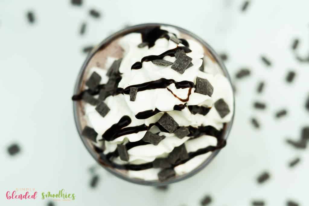 Easy Frozen Hot Chocolate Recipe 2 Easy Frozen Hot Chocolate photo taken from the top down with whipped cream chocolate syrup and chocolate shaving