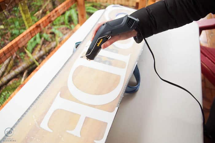 use heat gun to melt wax on bottom of snowboard