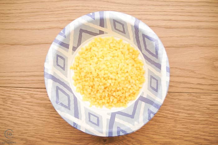 beeswax pellets in a bowl