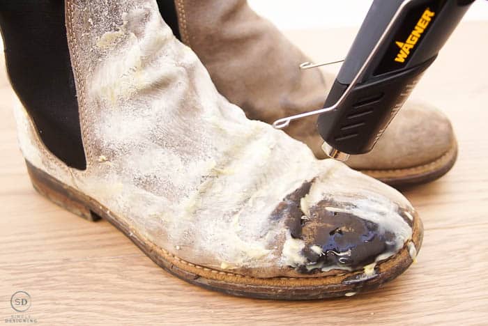 use a heat gun to waterproof leather boots by melting beeswax into boots