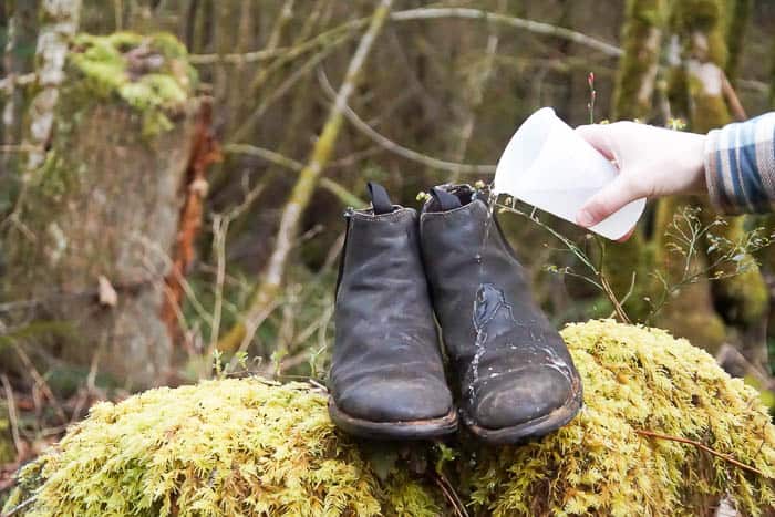 pouring water over newly waterproofed leather boots