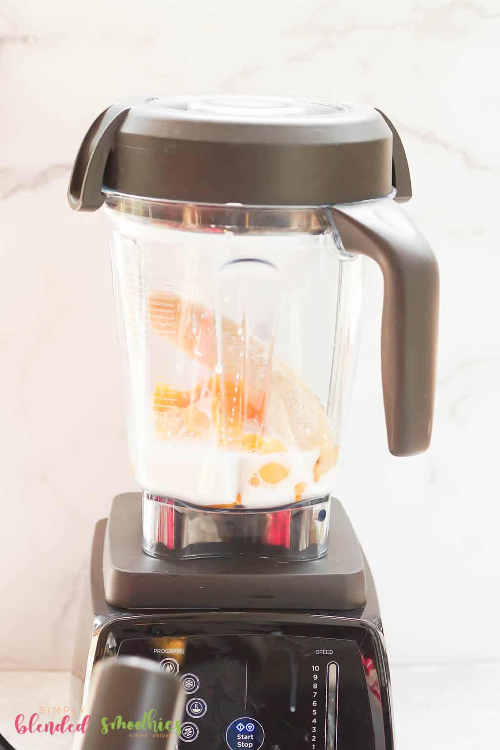 Banana Peach Smoothie 11 all smoothie ingredients in the blender