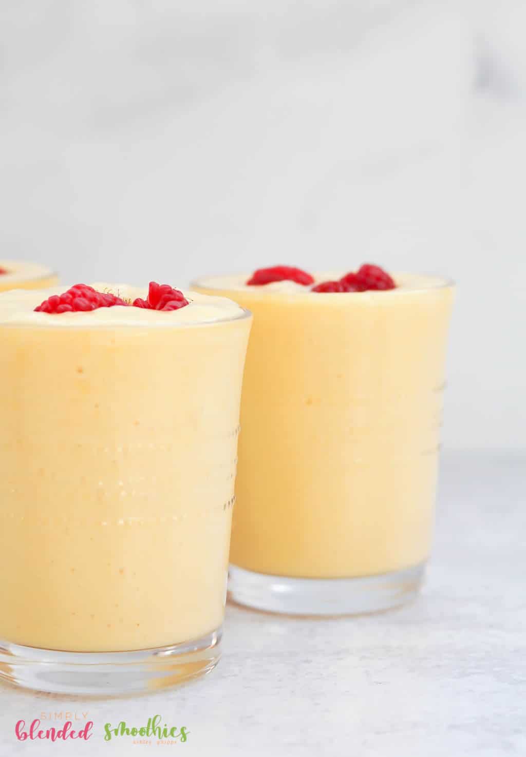 Banana Peach Smoothie 12 Banana Peach Smoothie with raspberries on top