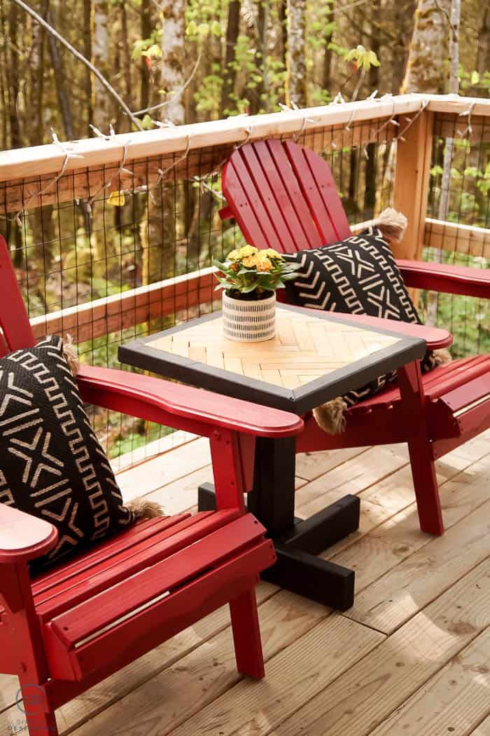 DIY End Table with herringbone pattern and two red adirondack chairs