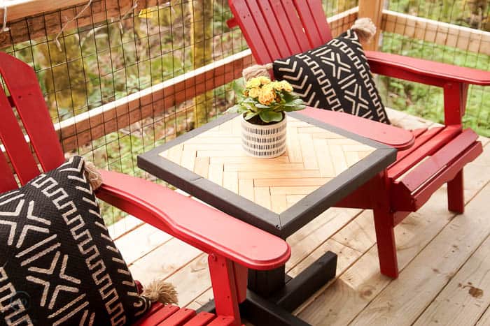 stained herringbone end table with adirondack chairs