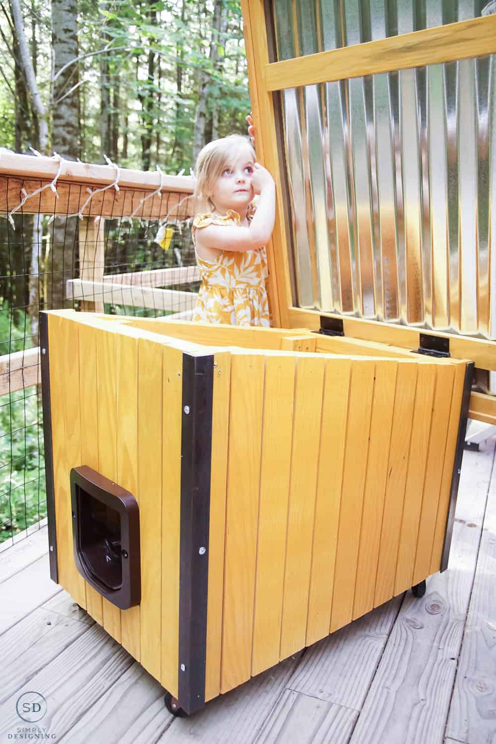 cat house with roof open for easy access for feeding etc vertical photo