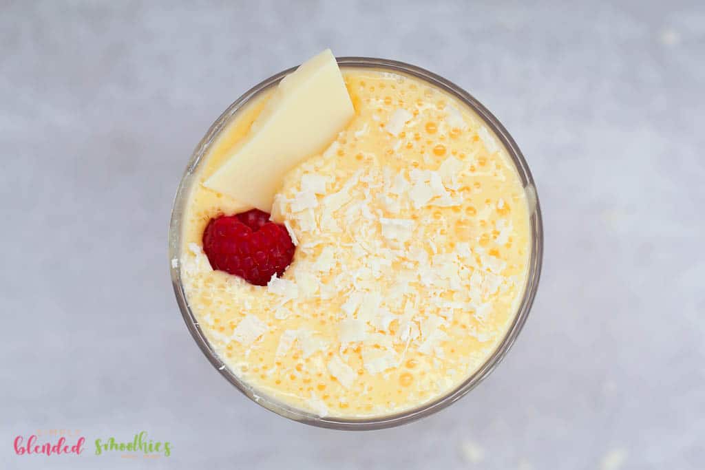 Peach Milkshake 2 milkshake made with peaches topped with white chocolate shavings and a raspberry plus a chunk of white chocolate