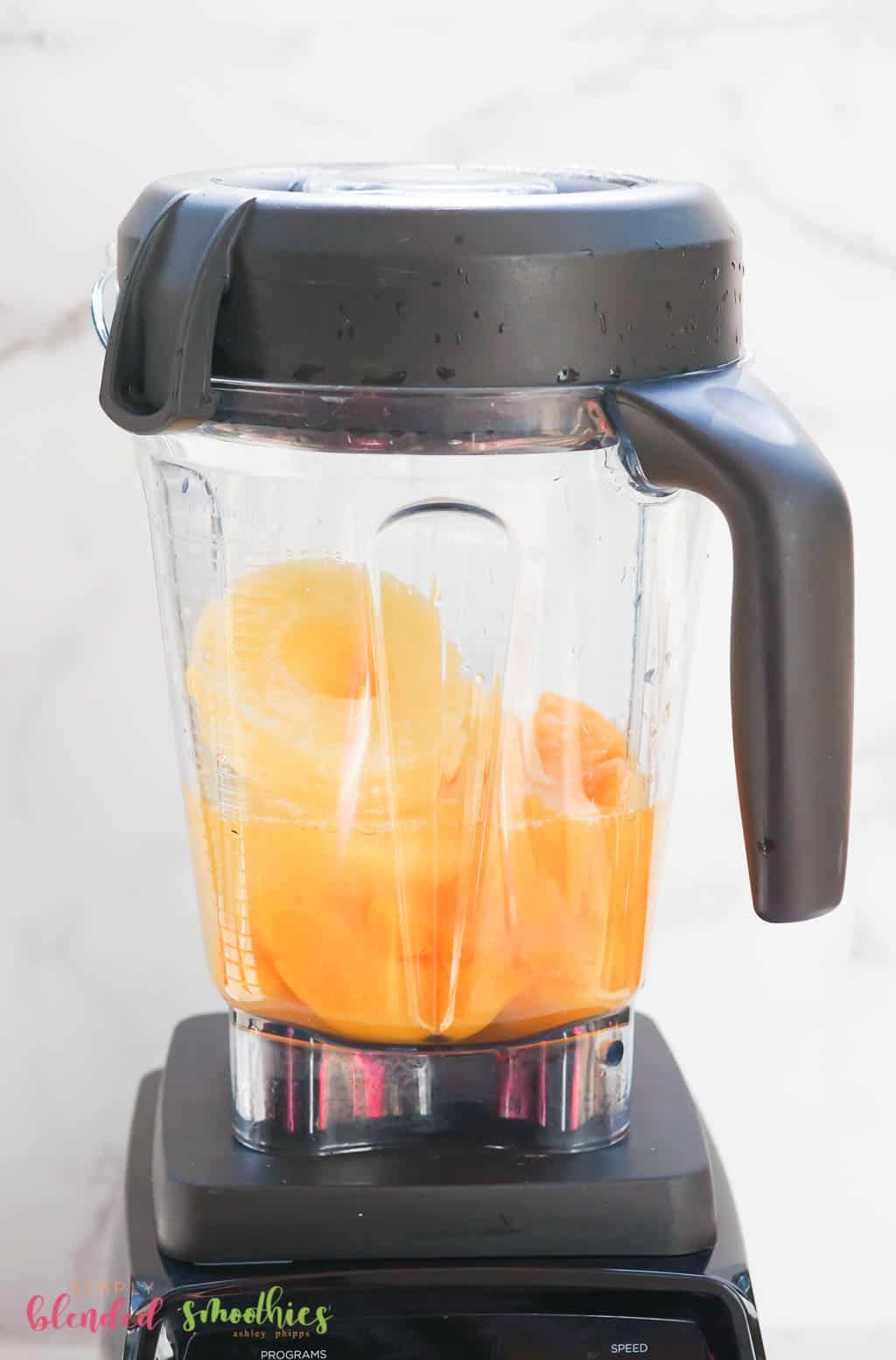 Peach Pineapple Smoothie 7 peaches and pineapple in a blender for a smoothie